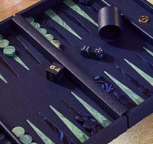 Manners Maketh Man (or Woman) and here is a quick escort ettiquette guide. A close up a blue leather Armani backgammon board.